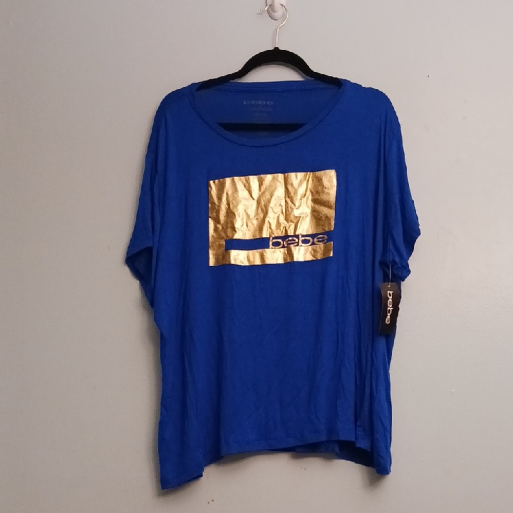 Bebe size 3X women's royal blue short sleeve T-shirt with metallic gold accent.